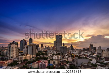 scenic of sunset twilight sky with cityscape town