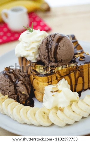 honey Toast and ice cream on white dish wood table