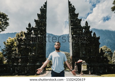 
Young and cheerful tourist enjoying the island of Bali in Indonesia. Knowing ancient Hindu temples, very spiritual places. Travel Photography. Lifestyle.
