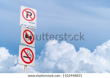 Traffic Signs: All three signs. On the sky background is a beautiful cloud.

Do not park, do not use a horn, do not smoke.