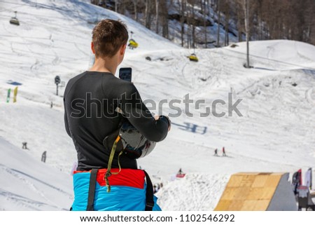 skier makes a photo of mountain scenery