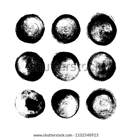 A set of hand drawn brush spots and splashes, ink and paint textures design elements. Black grungy circles isolated on white. Vector Illustration EPS 10 file.
