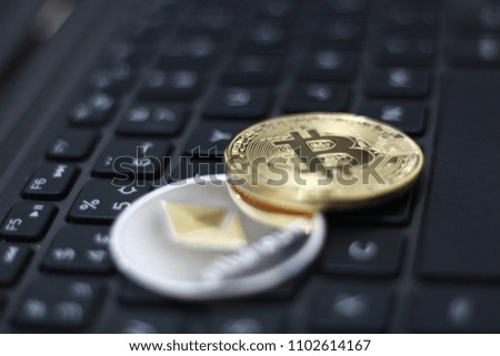 Cryptocurrency physical colored bitcoin coins. Pink bitcoin, blue bitcoin and yellow bitcoin