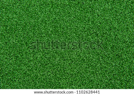 Background texture of synthetic grass or artificial turf used for mini golf and putt putt.