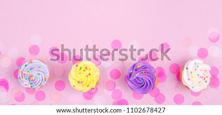 Creative pastel fantasy holiday card with cupcake and confetti. Baby shower, birthday, celebration concept. Horizontal, banner, wide screen format