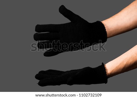 Female hands with disposable latex gloves wearing gesture, selective focus.