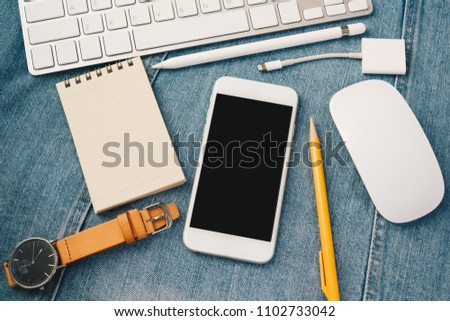 Smartphone mobile with black screen, can add text or pictures. With pencil, paper and watch.