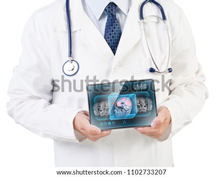 Doctor holding tablet displaying cerebral activity scan on screen