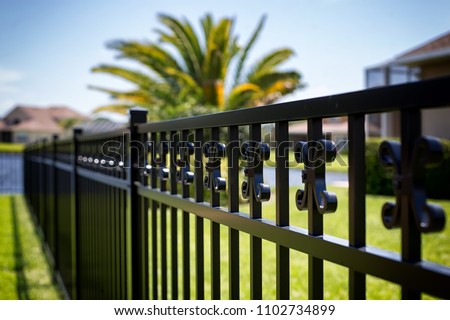 Black Aluminum Fence  Royalty-Free Stock Photo #1102734899
