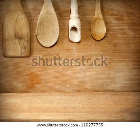 Old grunge vintage wooden cutting kitchen desk board with spoon