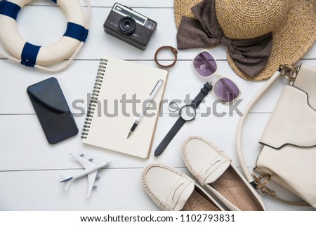Travel accessories costumes for women. Passports, The cost of travel maps prepared for the trip on white wood floor