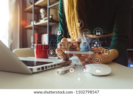 businessman or Designer using smart phone with laptop and digital tablet computer and document on desk in modern office with virtual interface graphic icons network diagram
