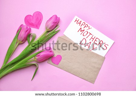Beautiful tulips and card with text HAPPY MOTHER'S DAY on color background