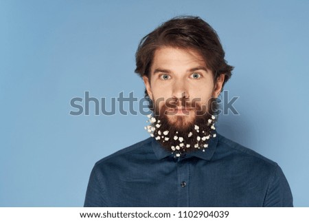 a man with white dots on his beard                          