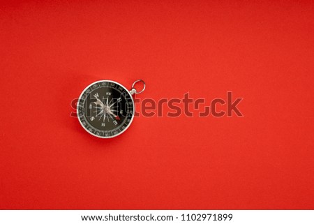 Direction concept with compass on red background top view mockup