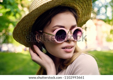 woman with glasses in the park                  