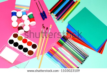Color pencils, brushes, paints. School supplies. Accessories for children's education.