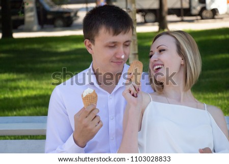 young lovers eat ice cream
