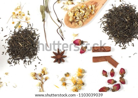 tea and herbs lie on a white background