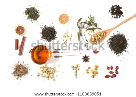 tea and herbs lie on a white background