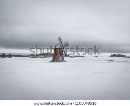 Windmill on snowy field Sweden