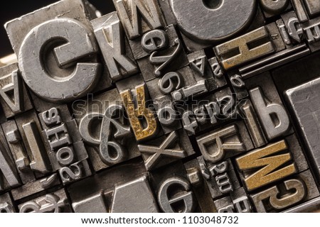 Metal Letterpress Types. 
A background from many historical typography letters in black and white with white background.
