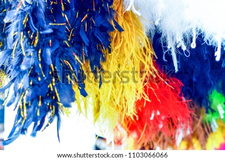 Various colorful feather boas in store for sale