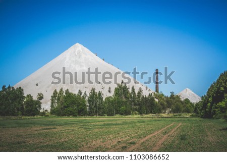 View to ash mountains formed from waste of oil shale mining in Luganuse Parish, Estonia. Royalty-Free Stock Photo #1103086652