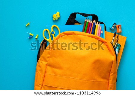 Back to school concept. Backpack with school supplies. Top view. Copy space Royalty-Free Stock Photo #1103114996
