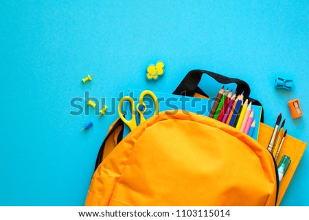 Back to school concept. Backpack with school supplies. Top view. Copy space Royalty-Free Stock Photo #1103115014