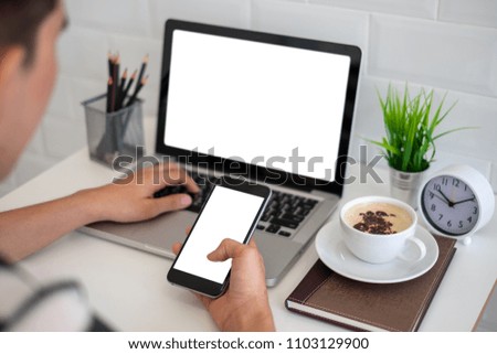 Cropped shot of an unrecognizable businessman using a mobile phone at office. Blank screen smart phone for graphic display montage.