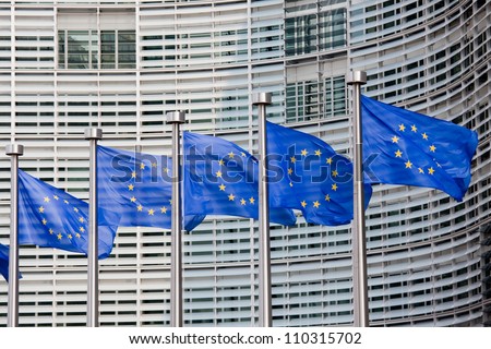 European flags in front of the Berlaymont building, headquarters of the European commission in Brussels. Royalty-Free Stock Photo #110315702