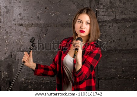 girl singing into the microphone