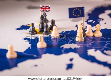 Chess pieces and flags on an European map focused black UK king. Brexit negociations and strategy concept between European Union and United Kingdom. Royalty-Free Stock Photo #1103194664