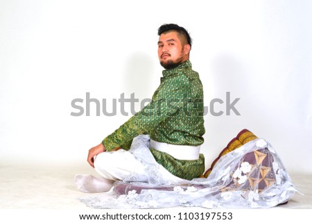 man wearing typical Thai dress and Thai traditionally with white background identity culture of Thailand