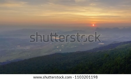 View morning of high mountain cover with soft fog, sunrise at Nok Aen Cliff, Phu Kradueng National Park, Loei, Thailand