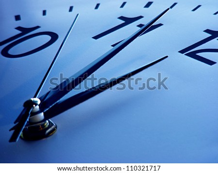 Clock face in blue tone. Time concept.