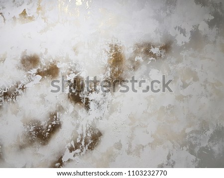 Gray wooden background of weathered distressed rustic wood with faded white paint showing woodgrain texture