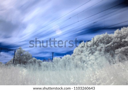 Surreal railway tracks. Infrared photography. Train line in infrared mode