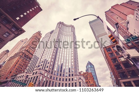 Retro cinematic style picture of skyscrapers at Lexington Avenue, New York City, USA.