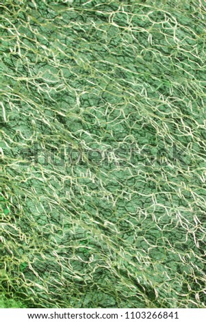 abstract texture woven fiber on a green background