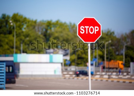 Stop sign, red road sign prohibiting passage.