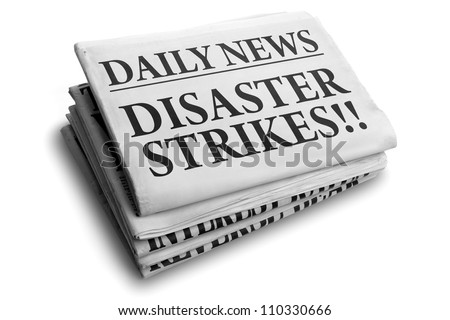 Daily news newspaper headline reading disaster strikes Royalty-Free Stock Photo #110330666
