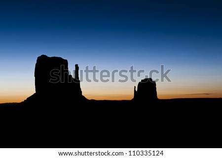 The Monument Valley mittens of Arizona at sunrise.