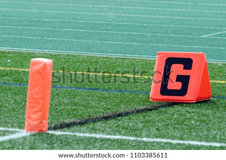 Orange Goal Marker And Pylon On Sideline
