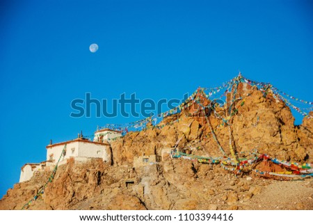 Ngari scenery in West Tibet. The Jiwu Temple and full moon on sunset clear sky near the holy Lake Manasarovar. Sacred place for Buddha pupils making piligrimage in Asia. Place of prayer and calm. 