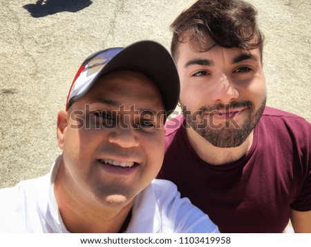 two male friends  taking a selfie 