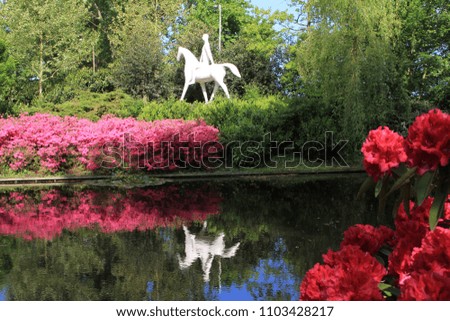 White statue with a person riding a horse in Keukenhof, Lisse, Netherlands