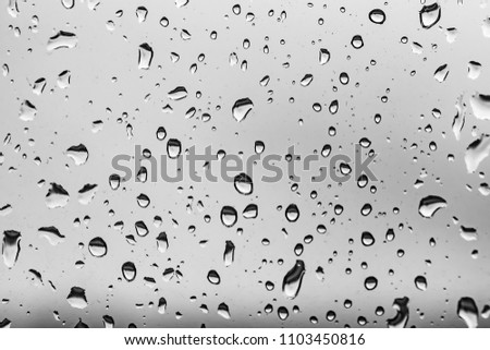raindrops on the window, black and white background