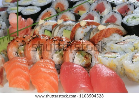 A large set of sushi rolls